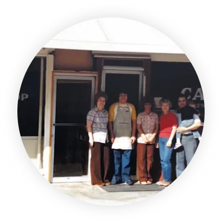 Lebaron's family in front of the restaurant.